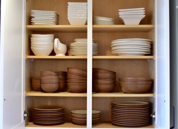 istock Open organized shelving in kitchen cabinets 1308313701