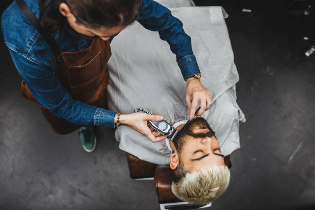 Barber Giving A shaving in His Shop