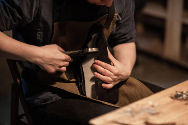 istock a hereditary shoemaker makes shoes from leather in the family workshop 1308316304