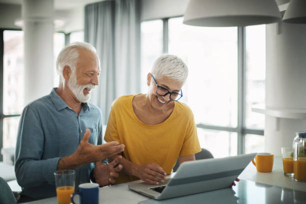 istock Mature couple buying some goods online 1308316308
