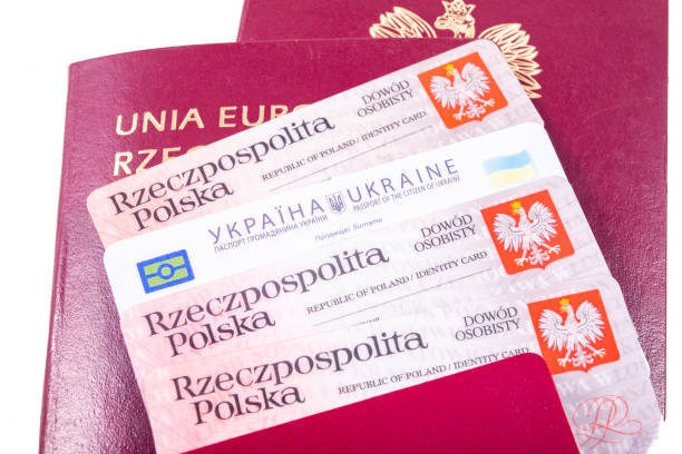 istock Identity documents, Polish and Ukrainian passports. Documents needed to cross the state border. Light background. 1308316883
