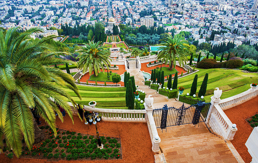Aerial view on beautiful  Bahai  gardensin Haifa. You can see Shrine of the Bab and town . grass on steep slope.\