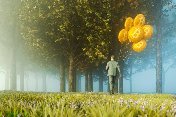 istock Businessman walking with bitcoin balloons 1308318405
