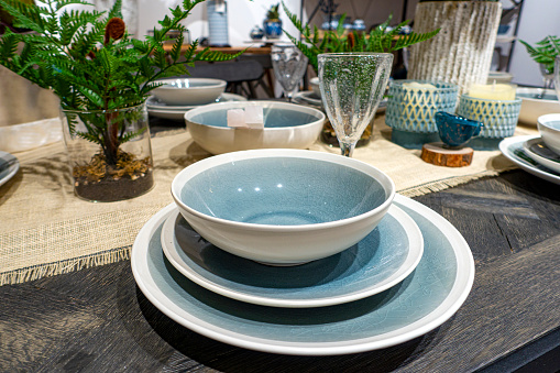 Close-up of prepared tableware with blue decoration.Table setting for an event party