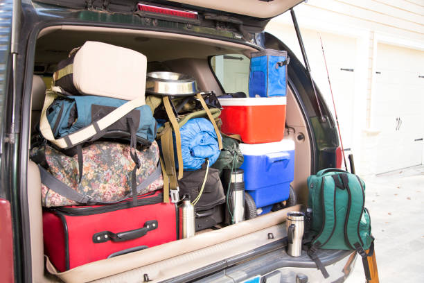 istock Packing vehicle for camping vacation trip. 1308319583