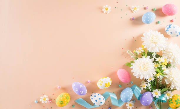 istock Happy easter! Colourful of Easter eggs in with flower on pastel background. Greetings and presents for Easter Day celebrate time. Flat lay ,top view. 1308324144