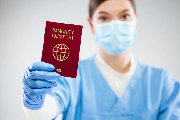 istock US CDC doctor holding red global immunity passport 1308331145