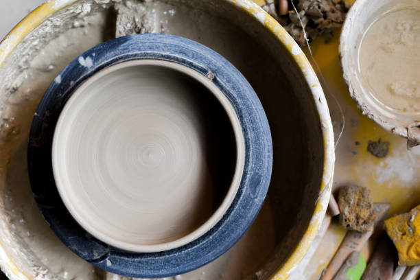 Pottery wheel with ceramics tools for making art and craft objects from clay in a workshop studio
