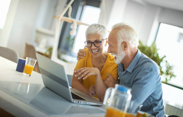 istock Mature couple buying some goods online 1308332052