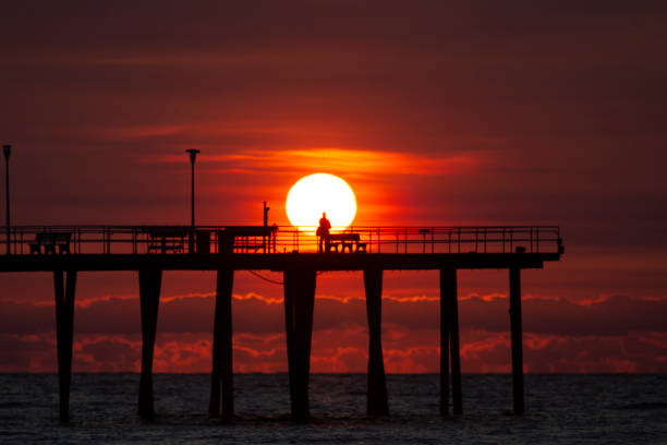 The sun rises over the Ventnor City Pier in Ventnor City, N.J., Oct. 18, 2020.