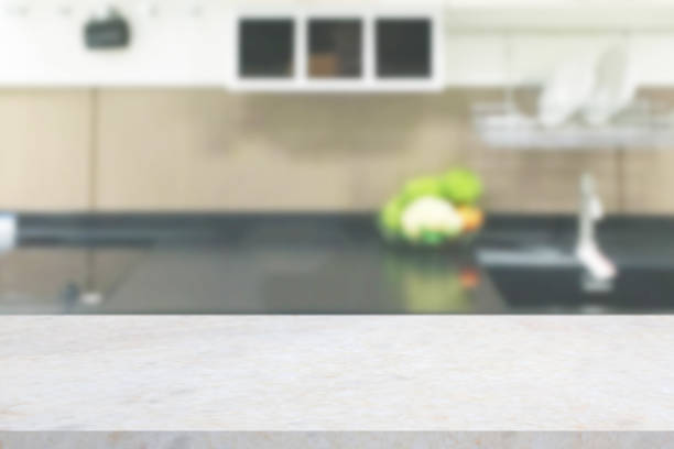 istock white marble stone counter top with blurred kitchen background 1308332822