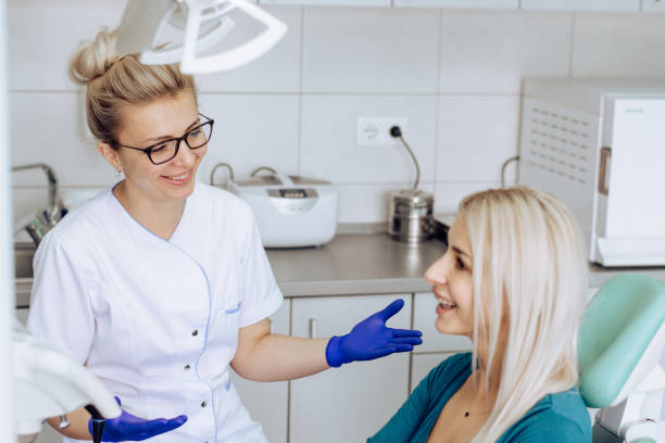 istock Dentist and her patient talking after the checkup 1308332859