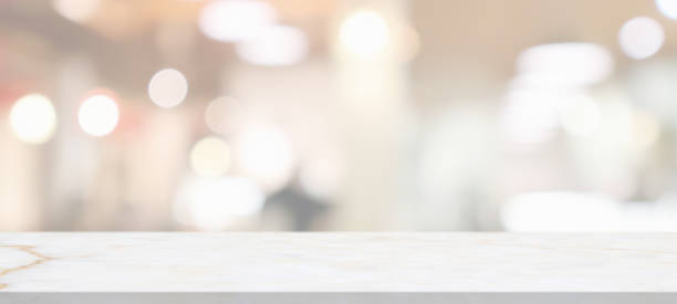 istock marble table top with blurred abstract cafe restaurant interior background 1308332907