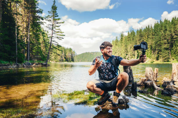 Young explorer photographing nature and vlogging.