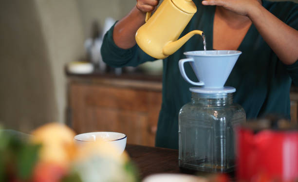 istock barista preparing brewing coffee with coffee maker and drip kettle. 1308333908