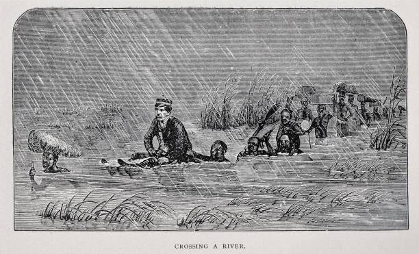 African natives hoist Dr. David Livingston, who is ill with malaria, above the high water as the Africans carry expedition supplies across a deep river in 1871.  Illustration published 1891. Source: Original edition is from my own archives. Copyright has expired and is in Public Domain.