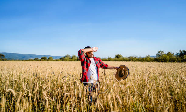 istock Tired farmer in a field 1308336062