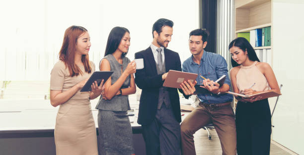 istock Teamwork Concept. Collaboration Team Meeting Communication with Business Teamwork Working Together in Conference Room. Presentation of Diversity Partner Business Meeting Trust in Businessman and Team 1308336243