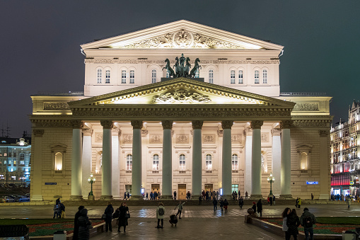 Moscow, Russia - January 17, 2021; Moscow. Night Russia Winter. People enter through the entrance Bolshoi Theatre