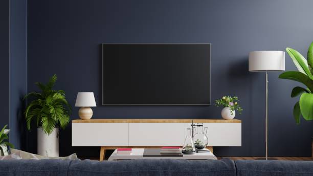 mockup tv on cabinet in modern empty room with behind the dark blue wall. - flat screen audio imagens e fotografias de stock