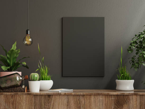 istock Mockup frame on cabinet in living room interior on empty dark wall background. 1308343311