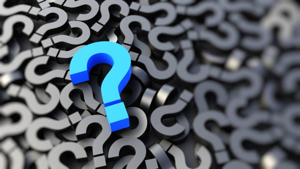 istock Blue question mark on a background of black signs, FAQ Concept 1308344121
