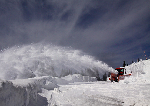 Snow blowing machine clearing the mountain highway in Olympic National Park
