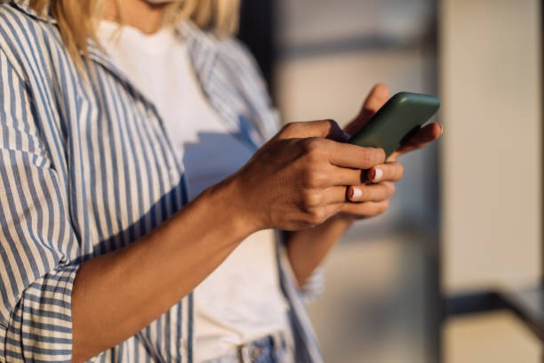 istock Glued to her phone 1308346311