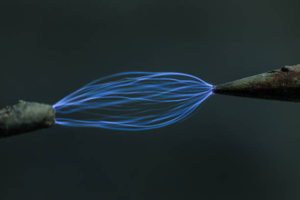 istock Electric cable close-up with glowing electricity lightning. Macro shot 1308347093