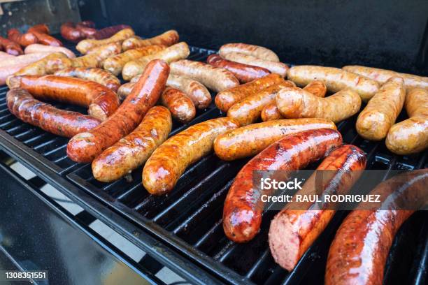 Grilling Sausage Stock Photo - Download Image Now - Sausage, Barbecue Grill, Barbecue - Meal