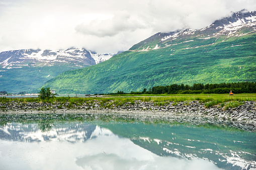 Traveling along the many miles of Alaska, many beautiful scenes play out. Visitors to the Valdez Bay, Also know as the Prince William sound, will experience beautiful mountains, reflections in the bay, and many other scenic views as they behold the beauty that this area has to offer.