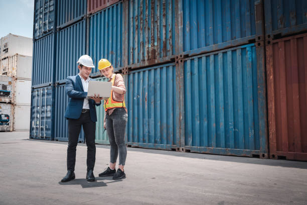istock Container Shipping Logistics Engineering of Import-Export Transportation Industry, Transport Engineers Teamwork Controlling Management Containers Together at Port Ship Loading Dock. Business Team 1308353189