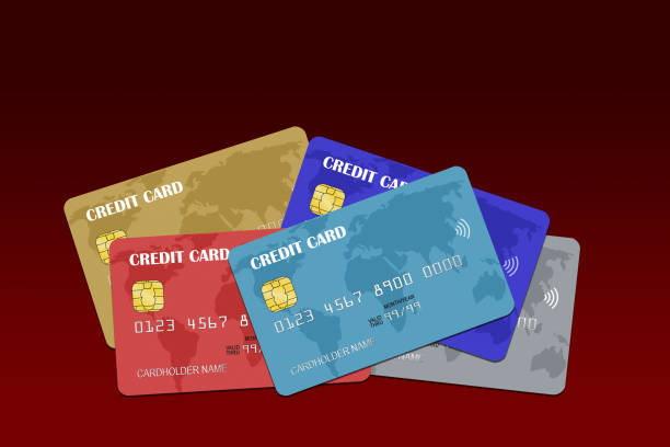 istock Several Credit Cards Stacked Isolated on Red Background 1308354052