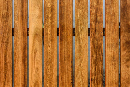 Wood fence texture of vertical planks with natural knots