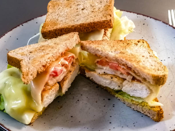 istock Sandwiches with fried chicken and salad 1308357409