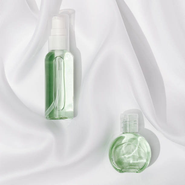 istock Small cosmetic bottle for cream or gel. Beauty product package, mock up plastic container on textile linen tablecloth white colored. 1308360947
