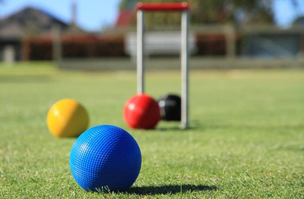 istock Croquet balls on a croquet lawn 1308363458