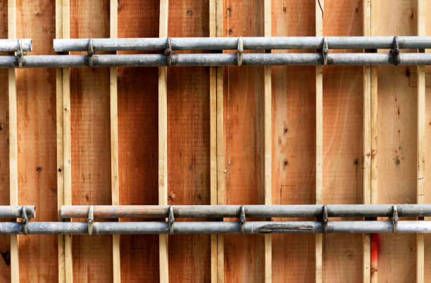 Wooden mold with steel pipe for concrete pouring.