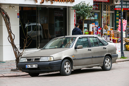 Istanbul, Turkey - February 11, 2021: Compact saloon car Fiat Tempra in the city street.