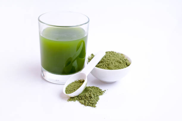 istock Green vegetable juice  and Powder 1308370331