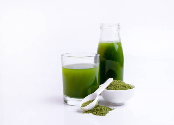 istock Green vegetable juice  and Powder 1308370348