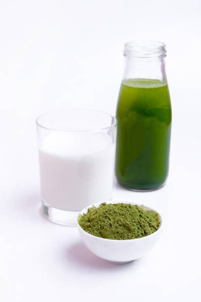 istock Green vegetable juice  and Powder 1308370350