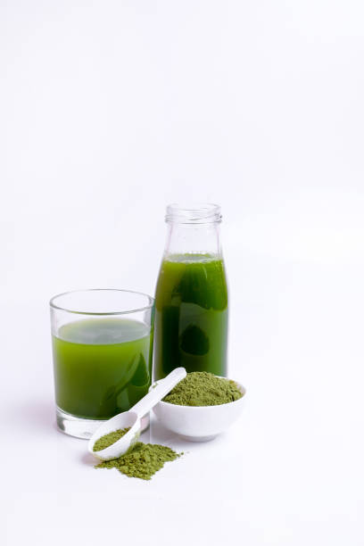 istock Green vegetable juice  and Powder 1308370351