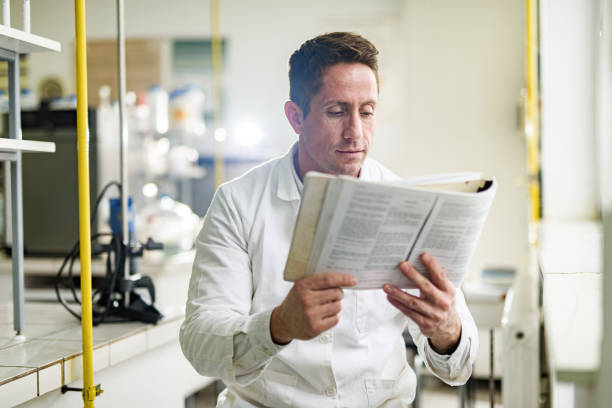 istock Scientist reading medical data in laboratory. 1308370947