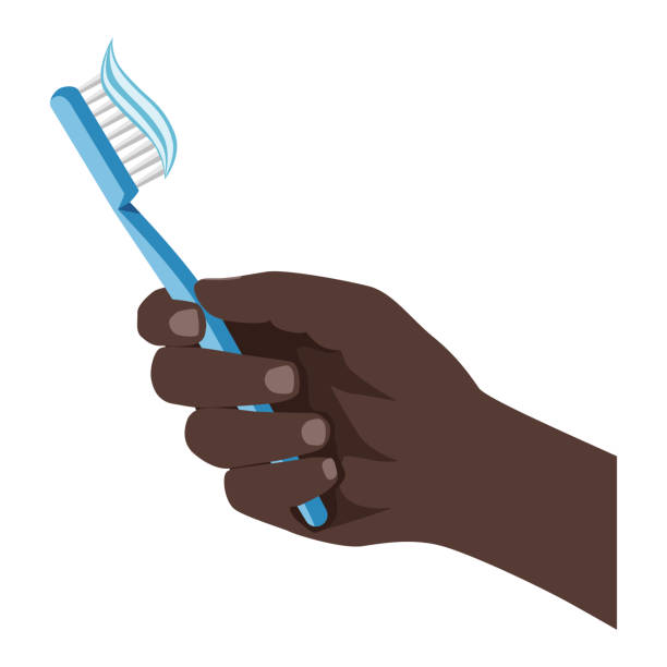 Hand with a toothbrush. A dark-skinned hand holds a toothbrush with toothpaste. Hygienic cleaning of the mouth. Dentistry and oral hygiene. Hand with a toothbrush. A dark-skinned hand holds a toothbrush with toothpaste. Hygienic cleaning of the mouth. Dentistry and oral hygiene. Vector illustration isolated on a white background for design and web. black man brushing teeth stock illustrations