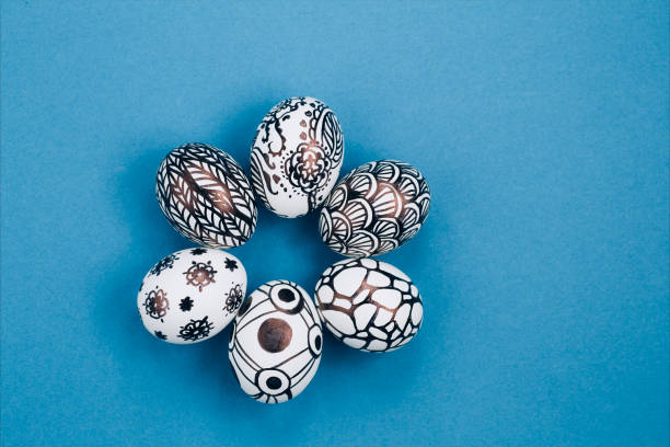 istock Easter eggs are painted black and white, abstraction, laid out in a circle 1308373895