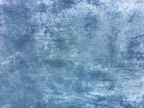 istock Texture decorative navy blue plaster imitating old peeling wall. Obsolete cracked stone background with pattern. 1308377177