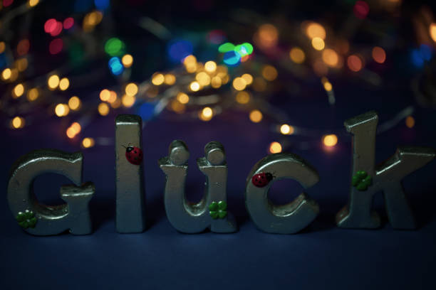 istock luck with bokeh, luck as letters, postcard, congratulations, congratulations 1308377447