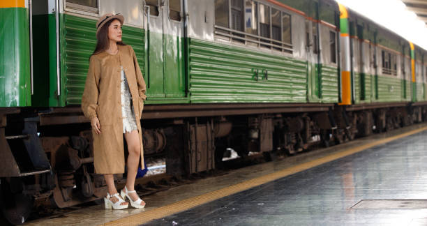 istock Young model travels on train at station railway in Summer 1308377755