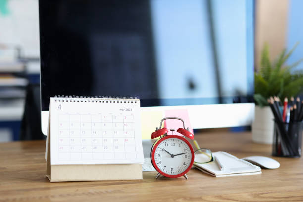istock Red alarm clock and calendar for 2021 on desktop 1308378505